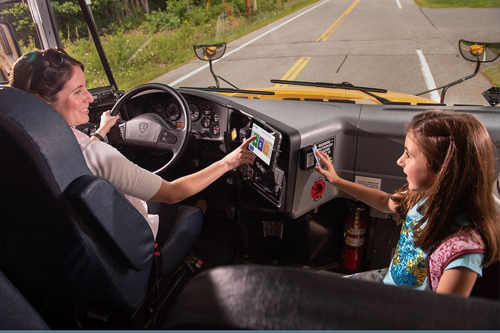 A bus driver checks in a student bus rider with their bus pass system Image courtesy of Tyler Technologies